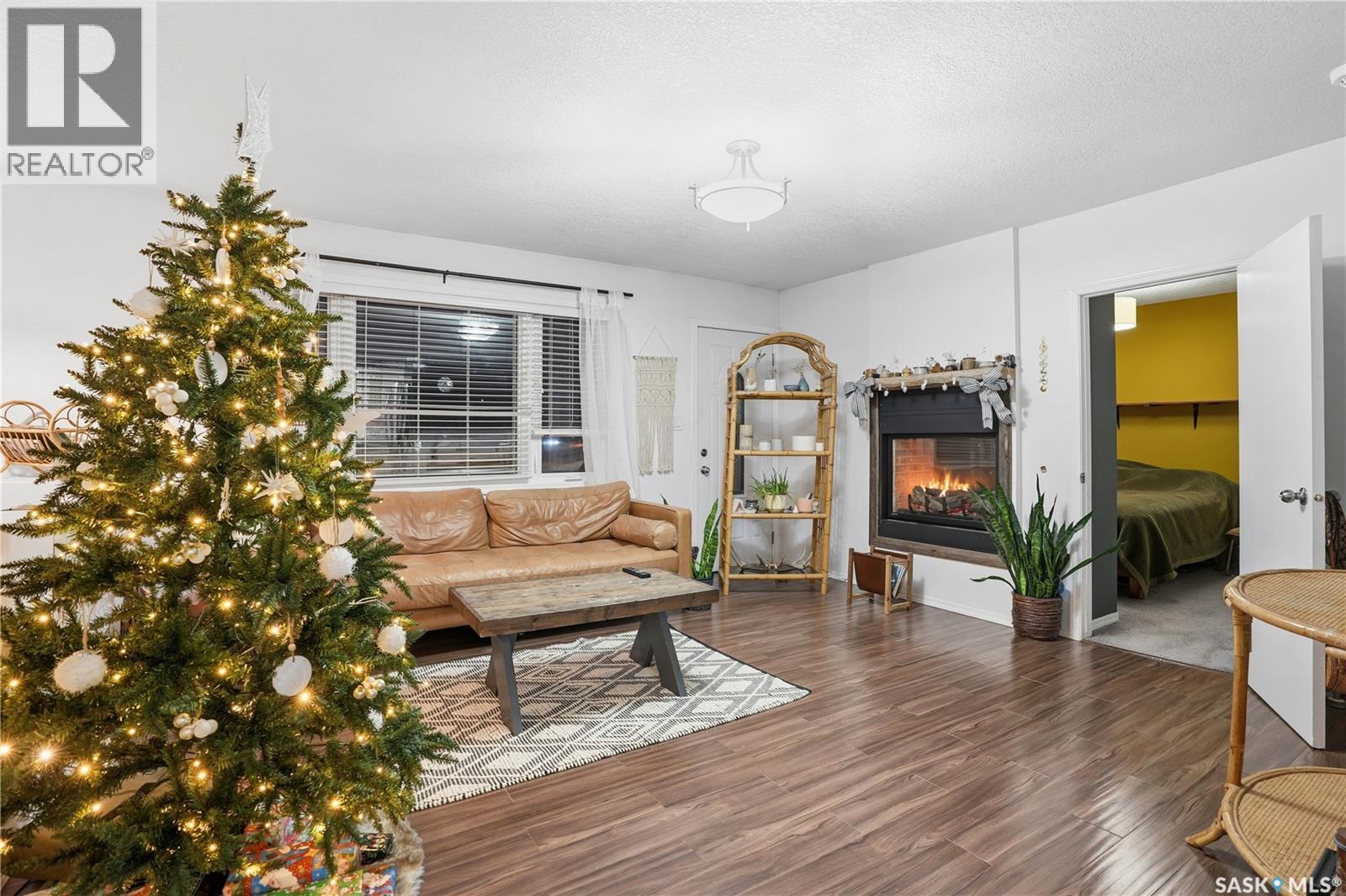 600 Mullin Avenue E, Regina, SK - Indoor Photo Showing Living Room With Fireplace