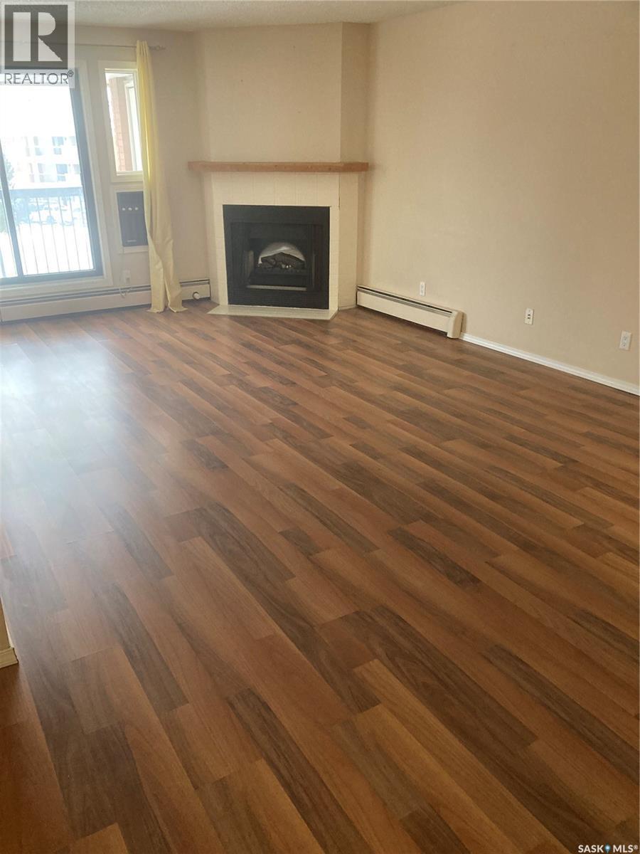 318 209B Cree Place, Saskatoon, SK - Indoor Photo Showing Living Room With Fireplace