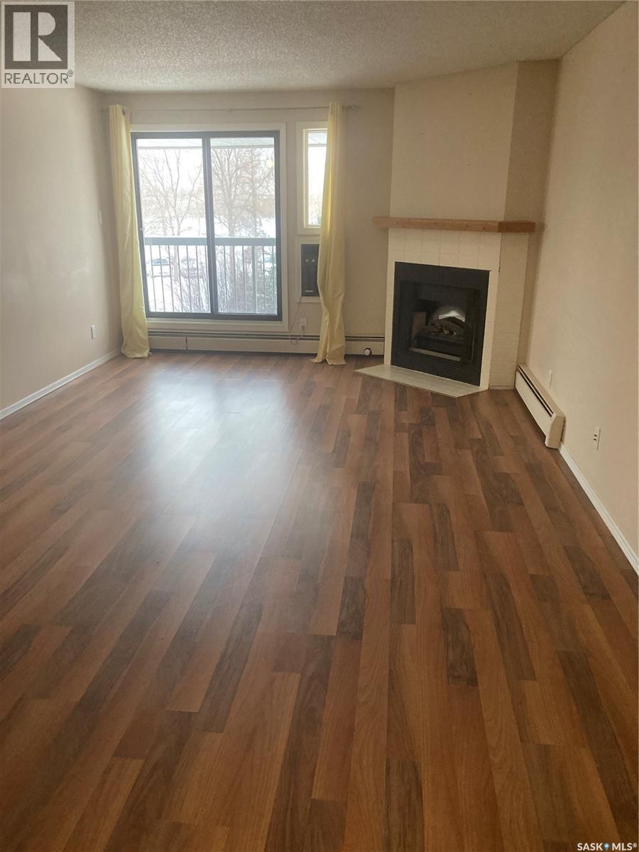 318 209B Cree Place, Saskatoon, SK - Indoor Photo Showing Living Room With Fireplace