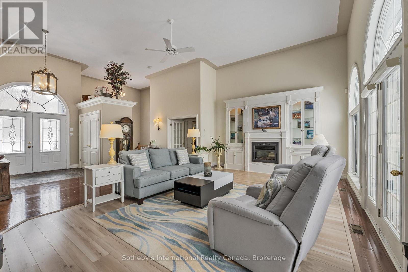 679 Sandy Bay Road, Tiny, ON - Indoor Photo Showing Living Room With Fireplace