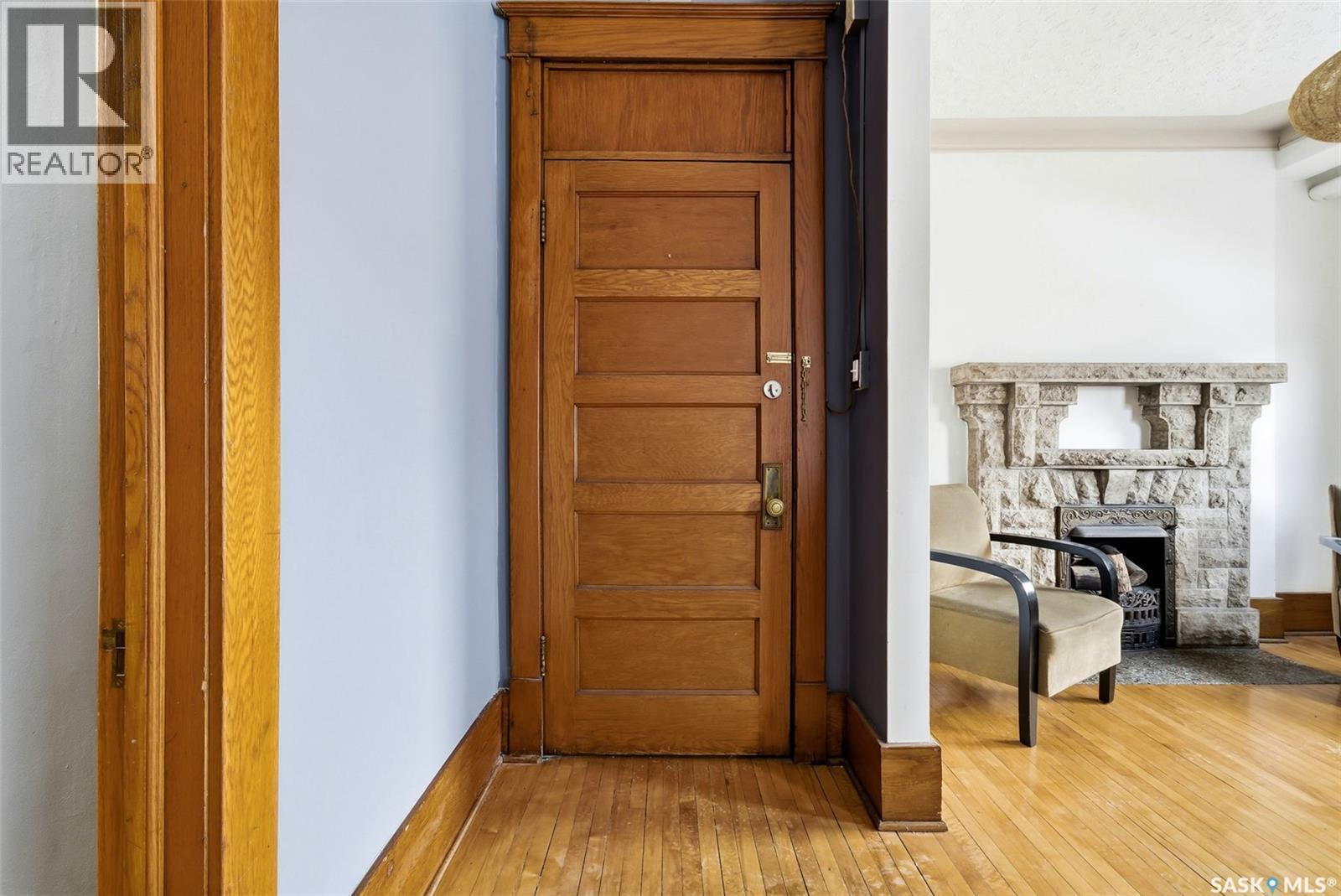 17 2201 14Th Avenue, Regina, SK - Indoor Photo Showing Other Room With Fireplace