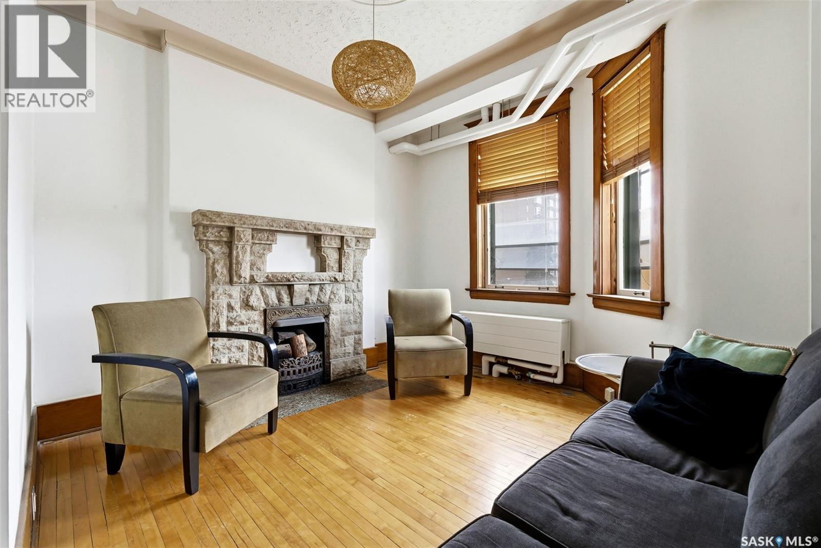 17 2201 14Th Avenue, Regina, SK - Indoor Photo Showing Living Room With Fireplace