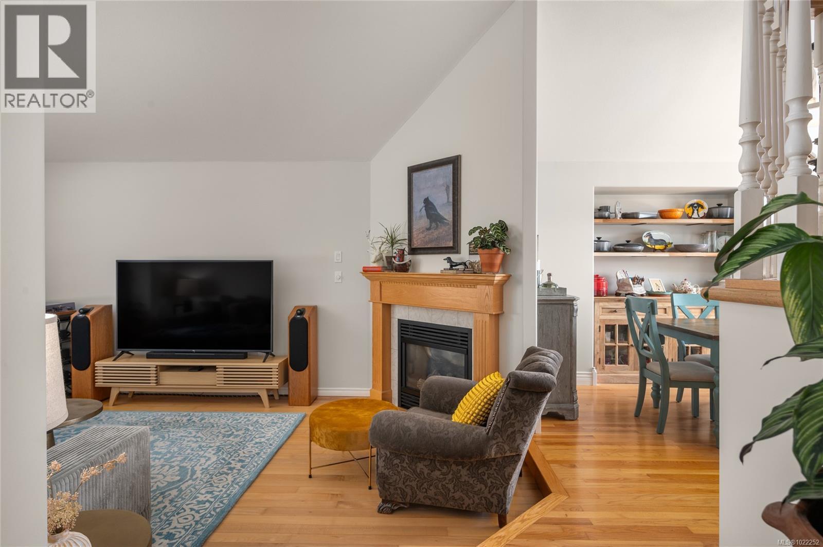 Two gas fireplaces (on main and lower floors)create a cozy feel. - 10091 View St, Chemainus, BC - Indoor Photo Showing Living Room With Fireplace