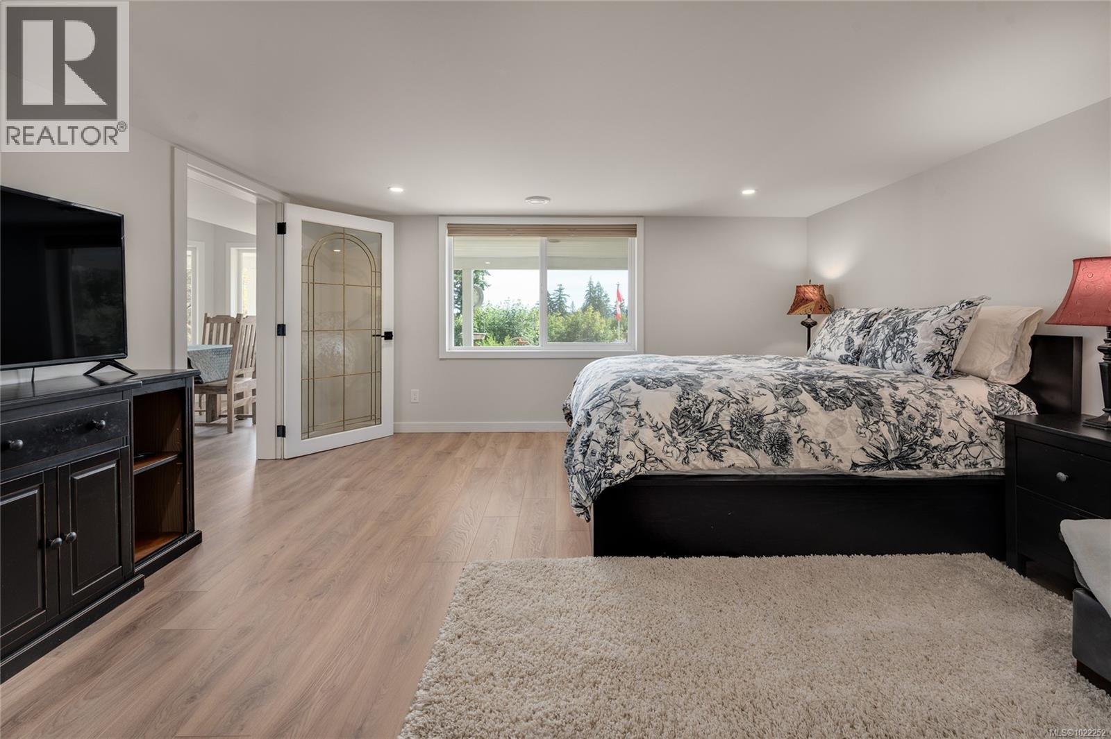 Suite's huge primary bedroom. - 10091 View St, Chemainus, BC - Indoor Photo Showing Bedroom