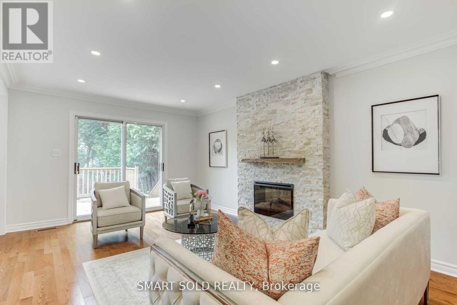 Upper Level - 45 Abbeywood Trail, Toronto, ON - Indoor Photo Showing Living Room With Fireplace
