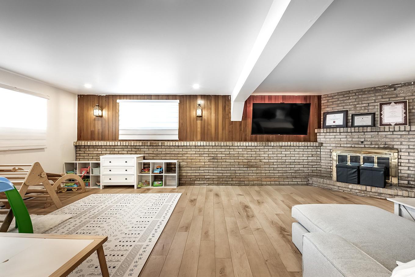 Playroom - 90 Rue Audubon, Dollard-Des-Ormeaux, QC - Indoor With Fireplace