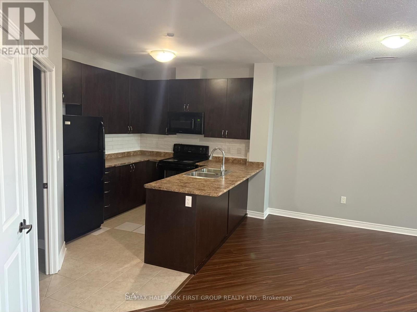 310 - 7400 Markham Road, Markham, ON - Indoor Photo Showing Kitchen With Double Sink
