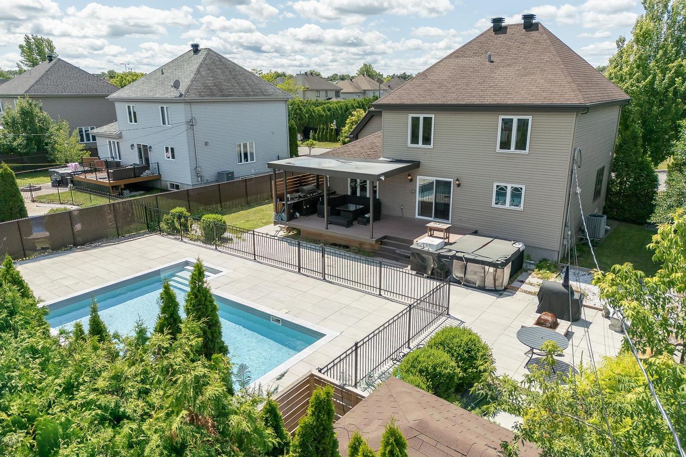Back facade - 111 Rue Jean-Paul-Lemieux, Notre-Dame-De-L'Île-Perrot, QC - Outdoor With In Ground Pool