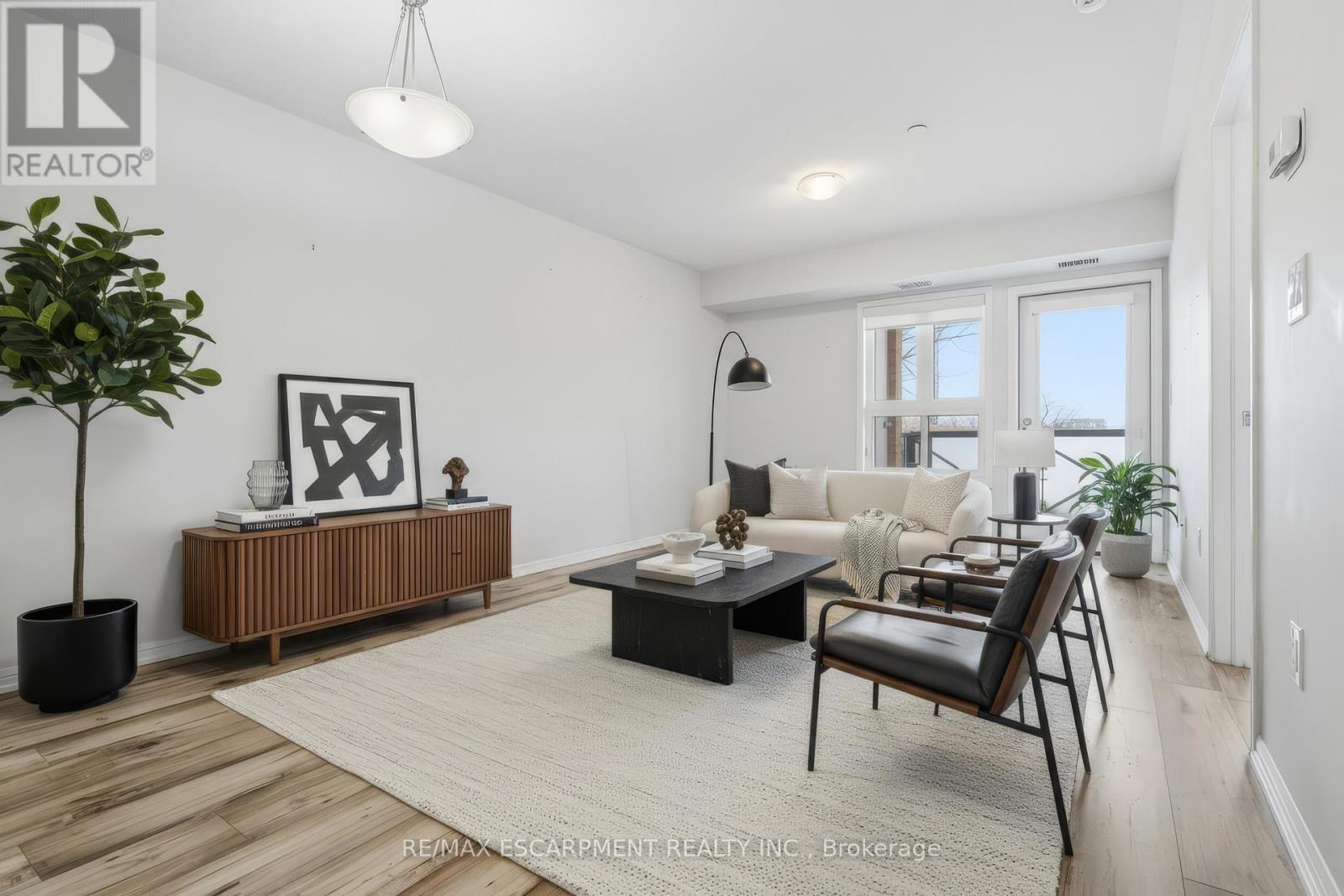 Main Living/Dining (virtually staged) - 107 - 1045 Nadalin Heights, Milton, ON - Indoor Photo Showing Living Room