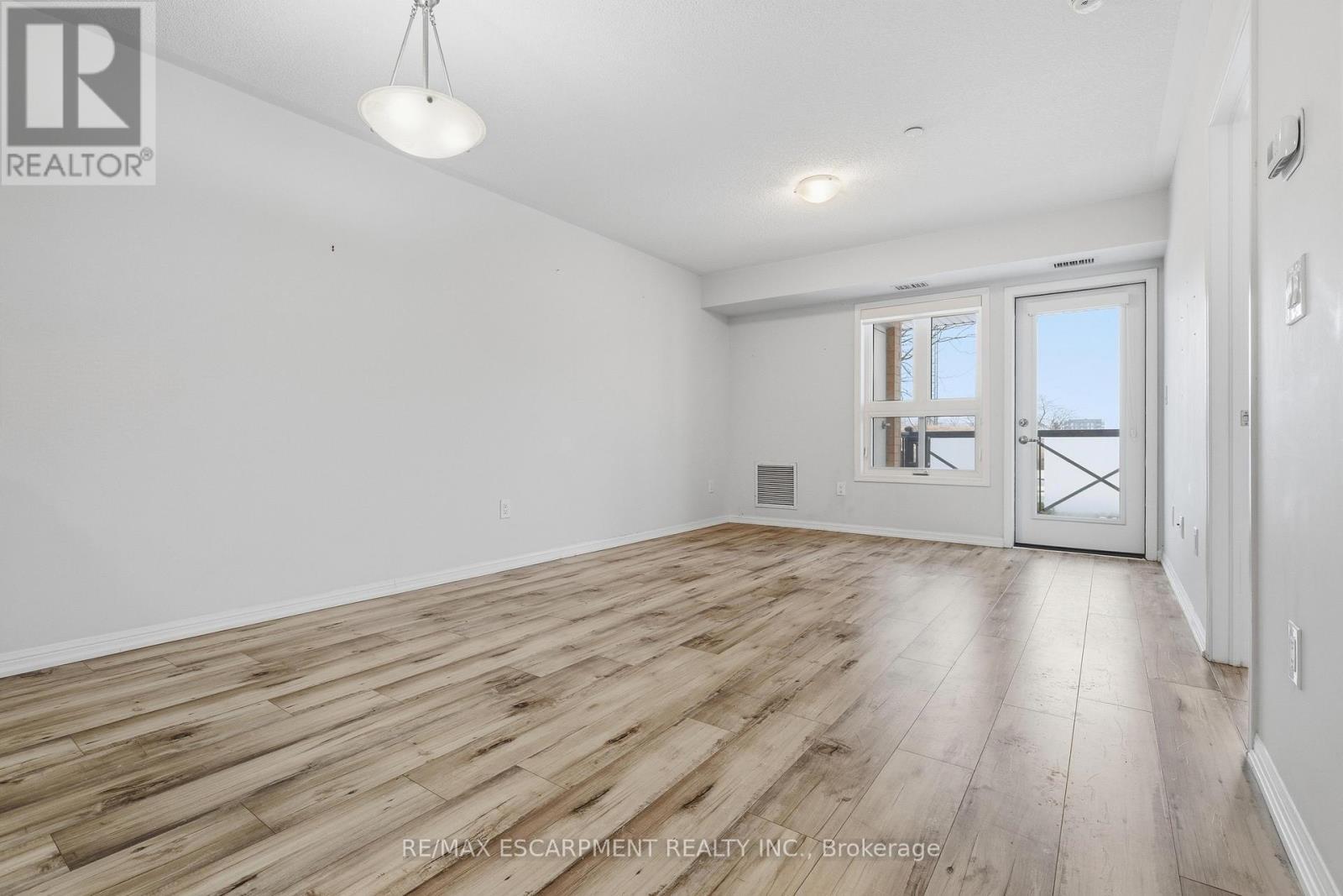 Access to Balcony - 107 - 1045 Nadalin Heights, Milton, ON - Indoor Photo Showing Other Room