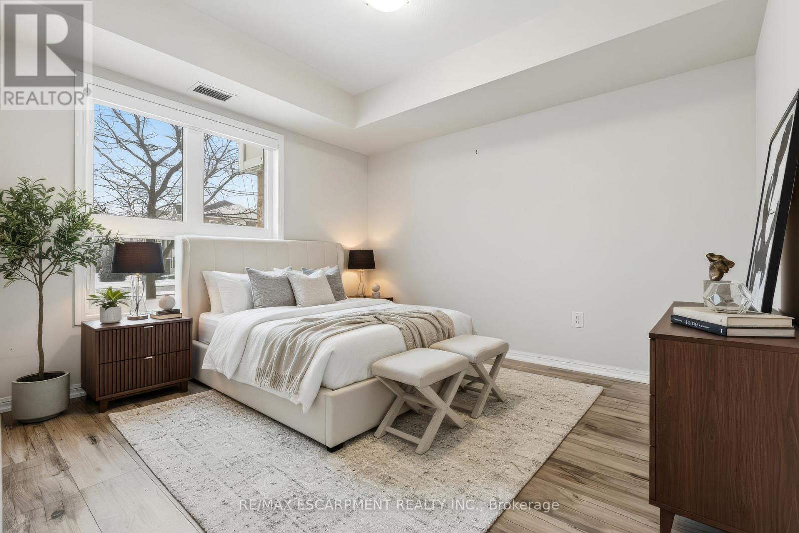 Bedroom (virtually staged) - 107 - 1045 Nadalin Heights, Milton, ON - Indoor Photo Showing Bedroom