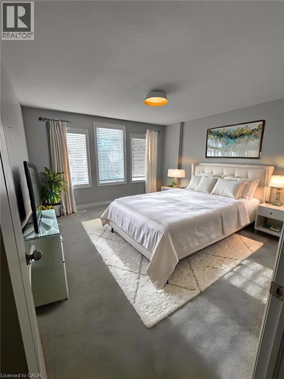 Bedroom featuring finished concrete floors - 93 Tremaine Drive, Kitchener, ON - Indoor Photo Showing Bedroom