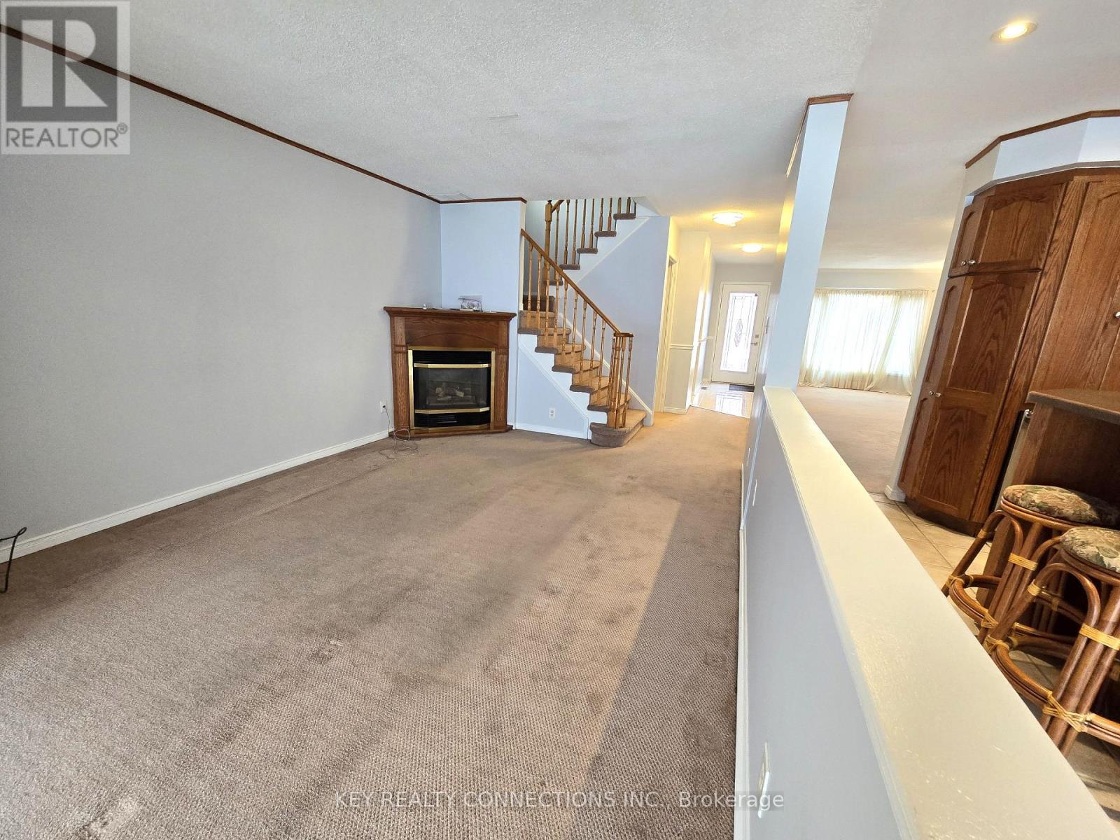 Family overlooking kitchen & sunroom - 2425 Headon Forest Drive, Burlington, ON - Indoor With Fireplace