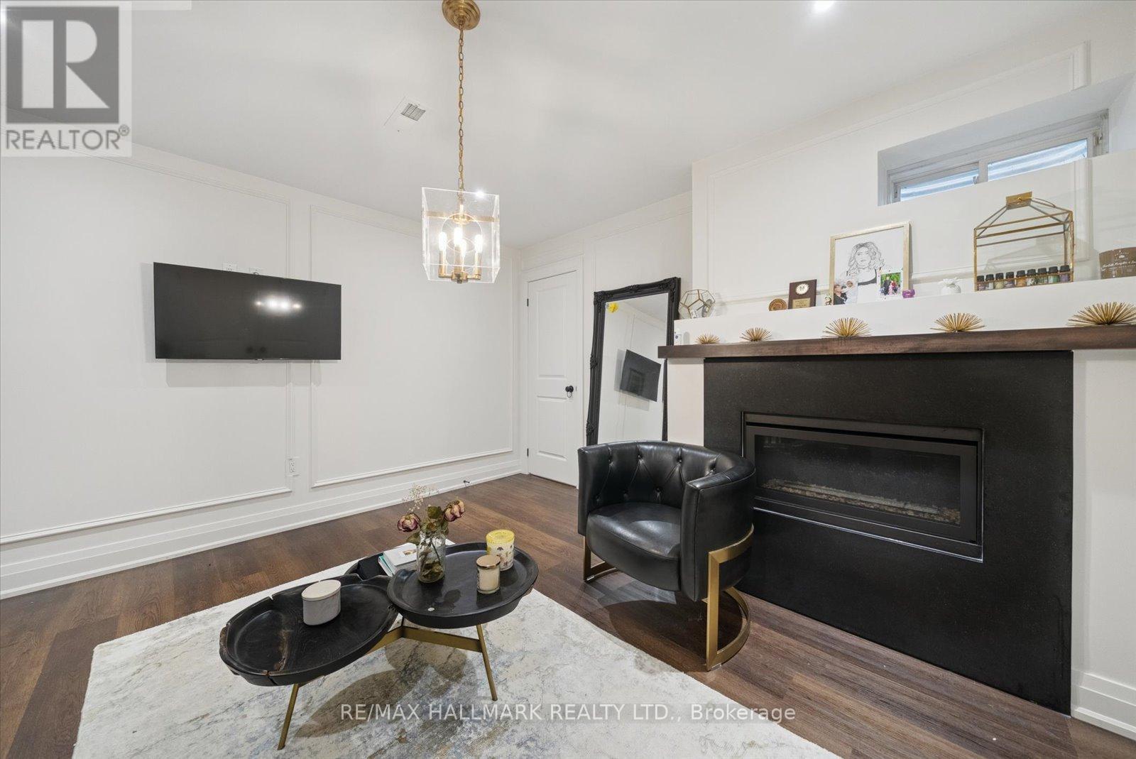 Basement - 312 Main Unionville Street, Markham, ON - Indoor Photo Showing Living Room With Fireplace