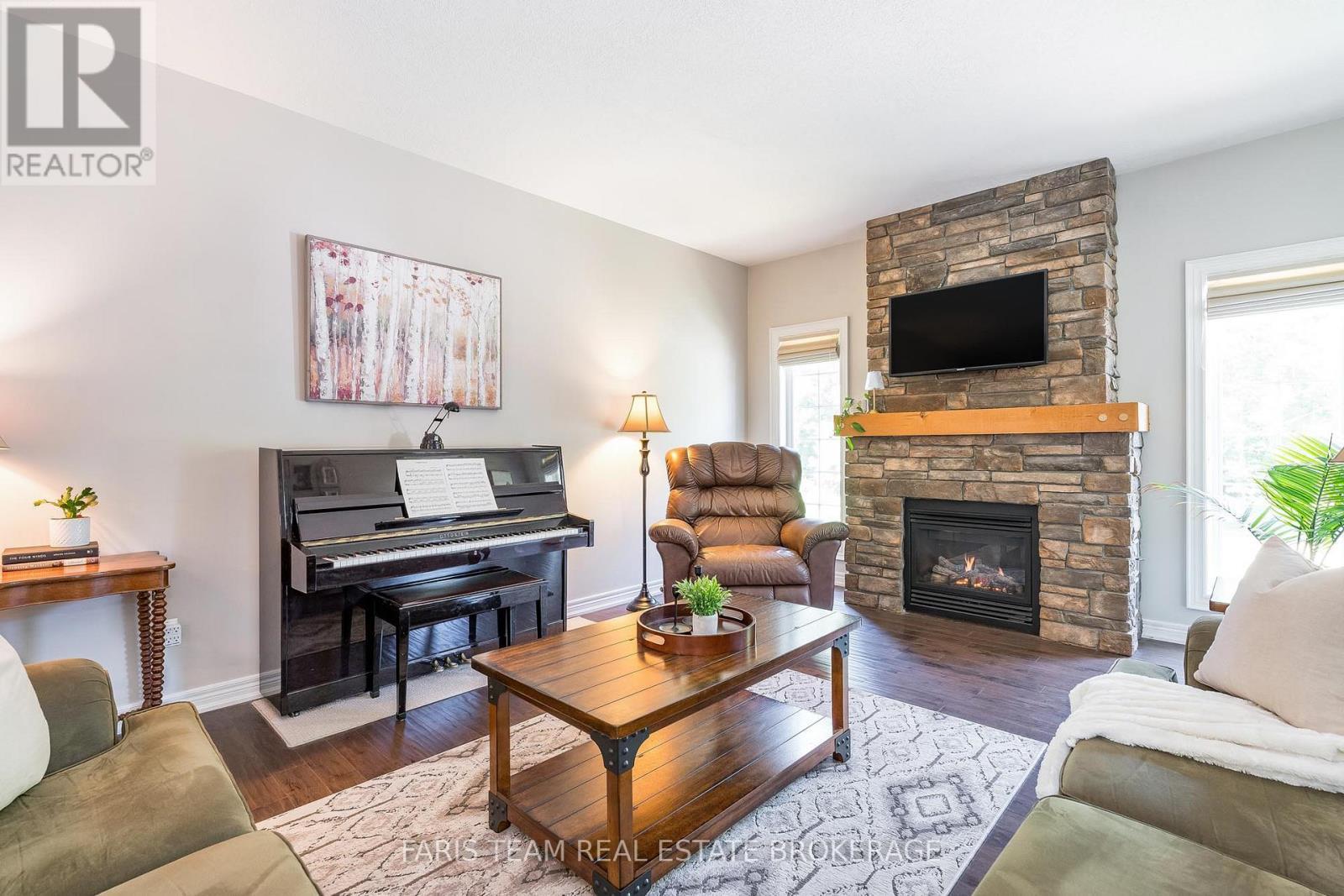 35 Parr Boulevard, Springwater, ON - Indoor Photo Showing Living Room With Fireplace