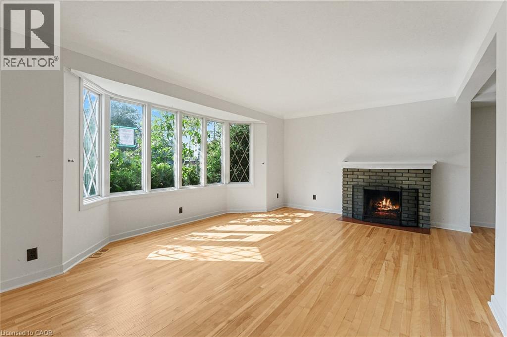 809 Smyth Road, Ottawa, ON - Indoor Photo Showing Living Room With Fireplace