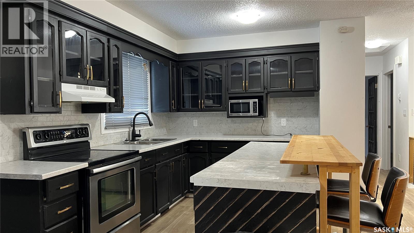310 5Th Avenue, Cudworth, SK - Indoor Photo Showing Kitchen With Double Sink