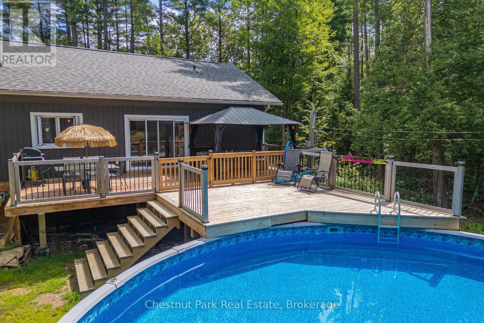2698 Old Muskoka Road, Huntsville (Stephenson), ON - Outdoor With Above Ground Pool With Deck Patio Veranda With Backyard