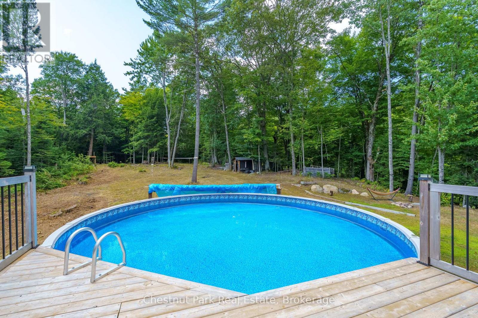 2698 Old Muskoka Road, Huntsville (Stephenson), ON - Outdoor With Above Ground Pool With Deck Patio Veranda With Backyard
