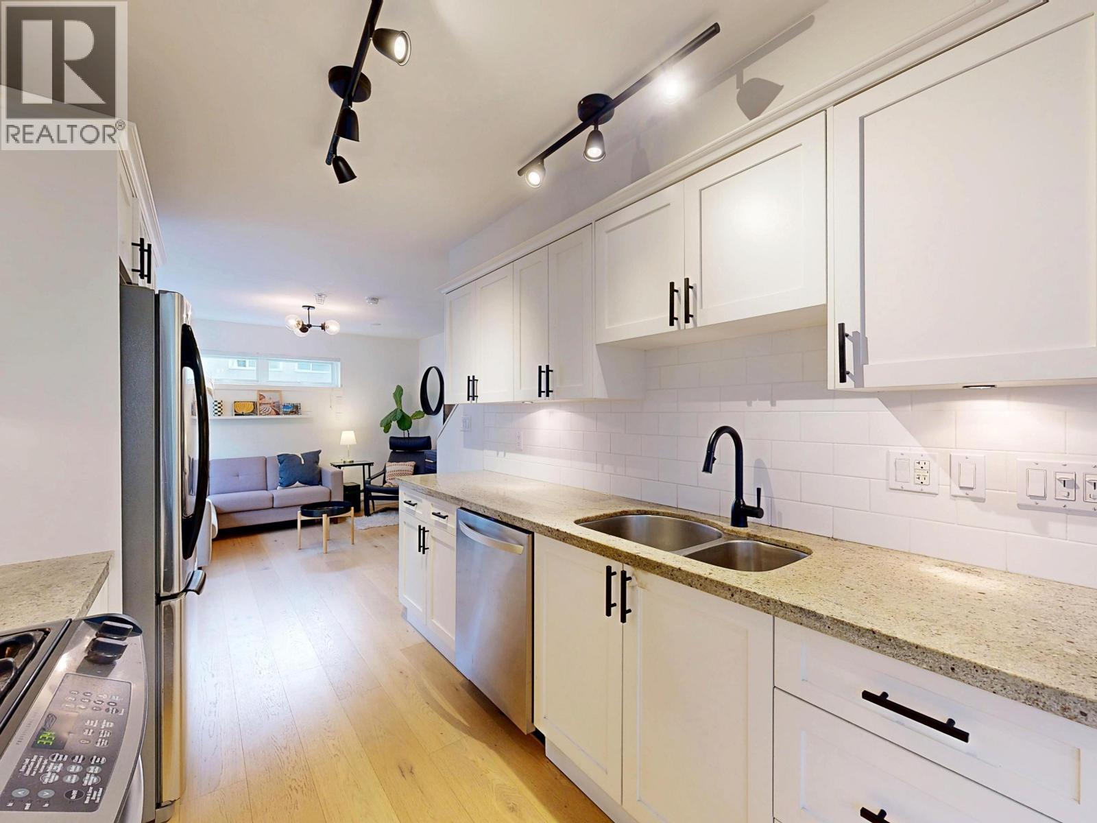 101 1672 E Pender Street, Vancouver, BC - Indoor Photo Showing Kitchen With Double Sink