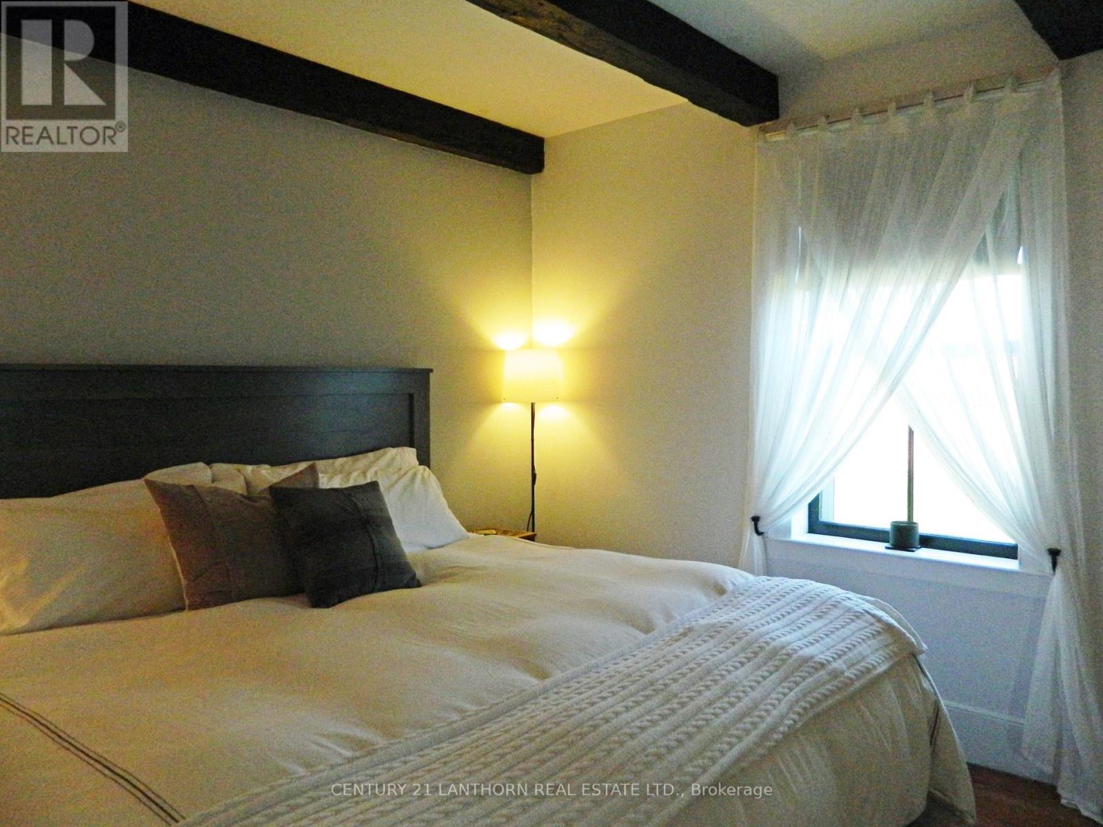 Primary bedroom on main level - 644 County 10 Road, Prince Edward County (Hallowell Ward), ON - Indoor Photo Showing Bedroom