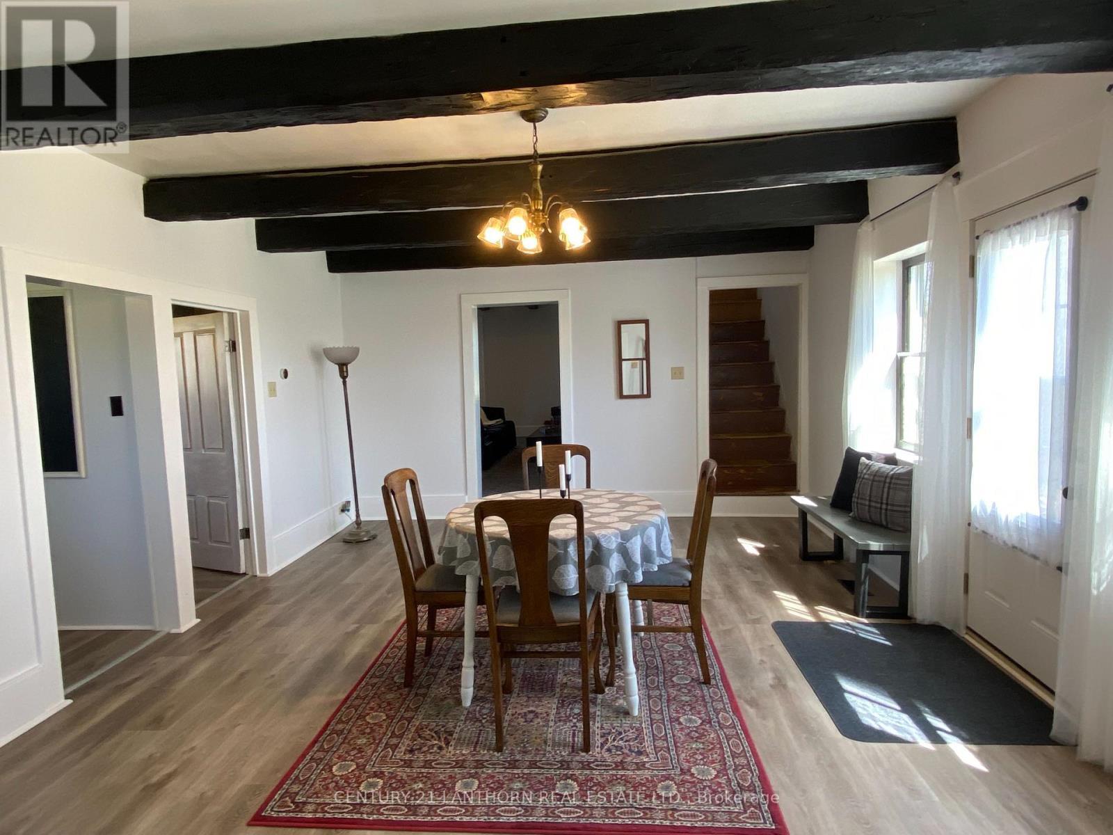 Central dining room with stairs to 2nd level - 644 County 10 Road, Prince Edward County (Hallowell Ward), ON - Indoor Photo Showing Dining Room