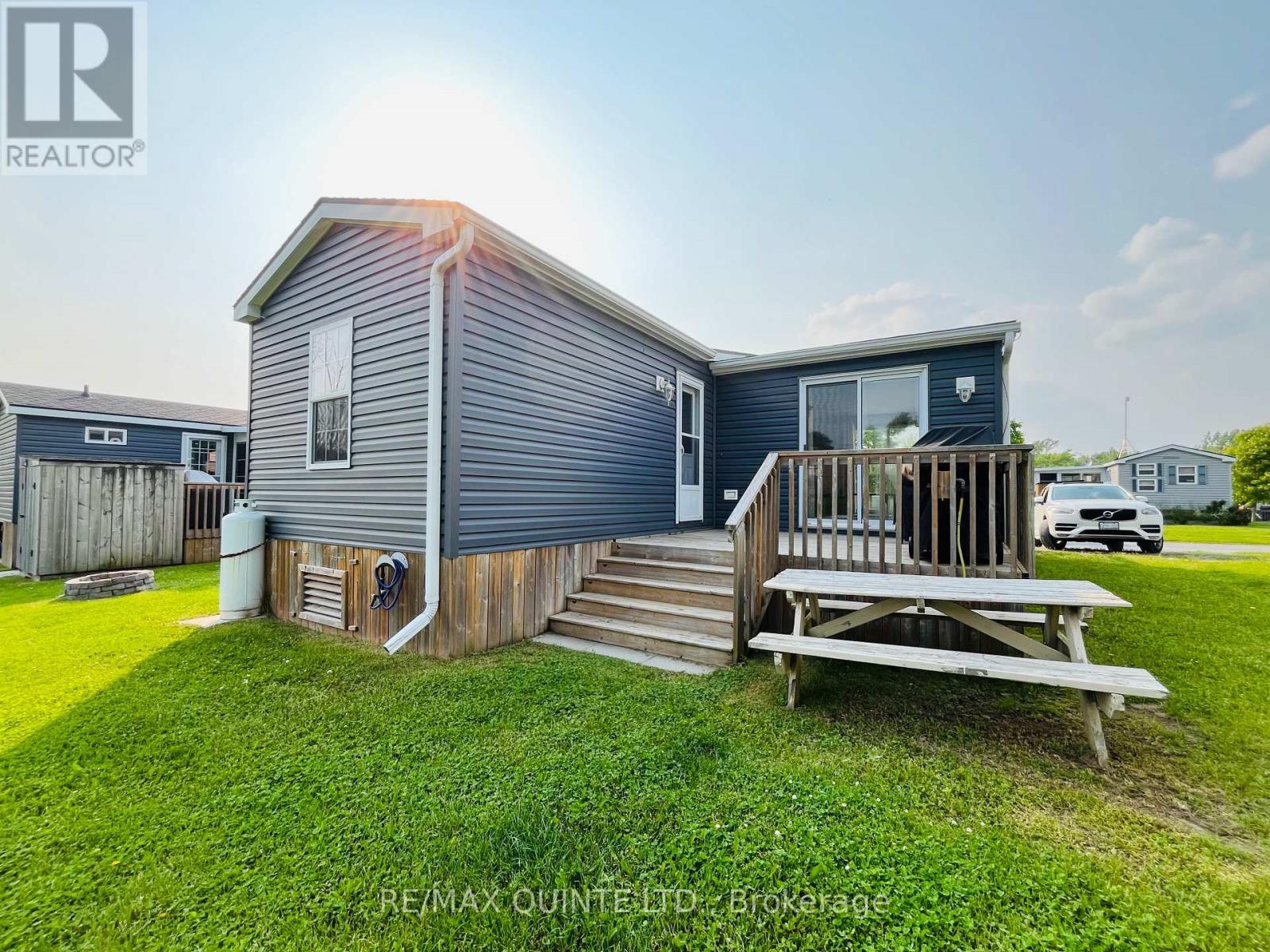 8 Cricket Ln - 486 County Road 18, Prince Edward County (Athol Ward), ON - Outdoor With Deck Patio Veranda