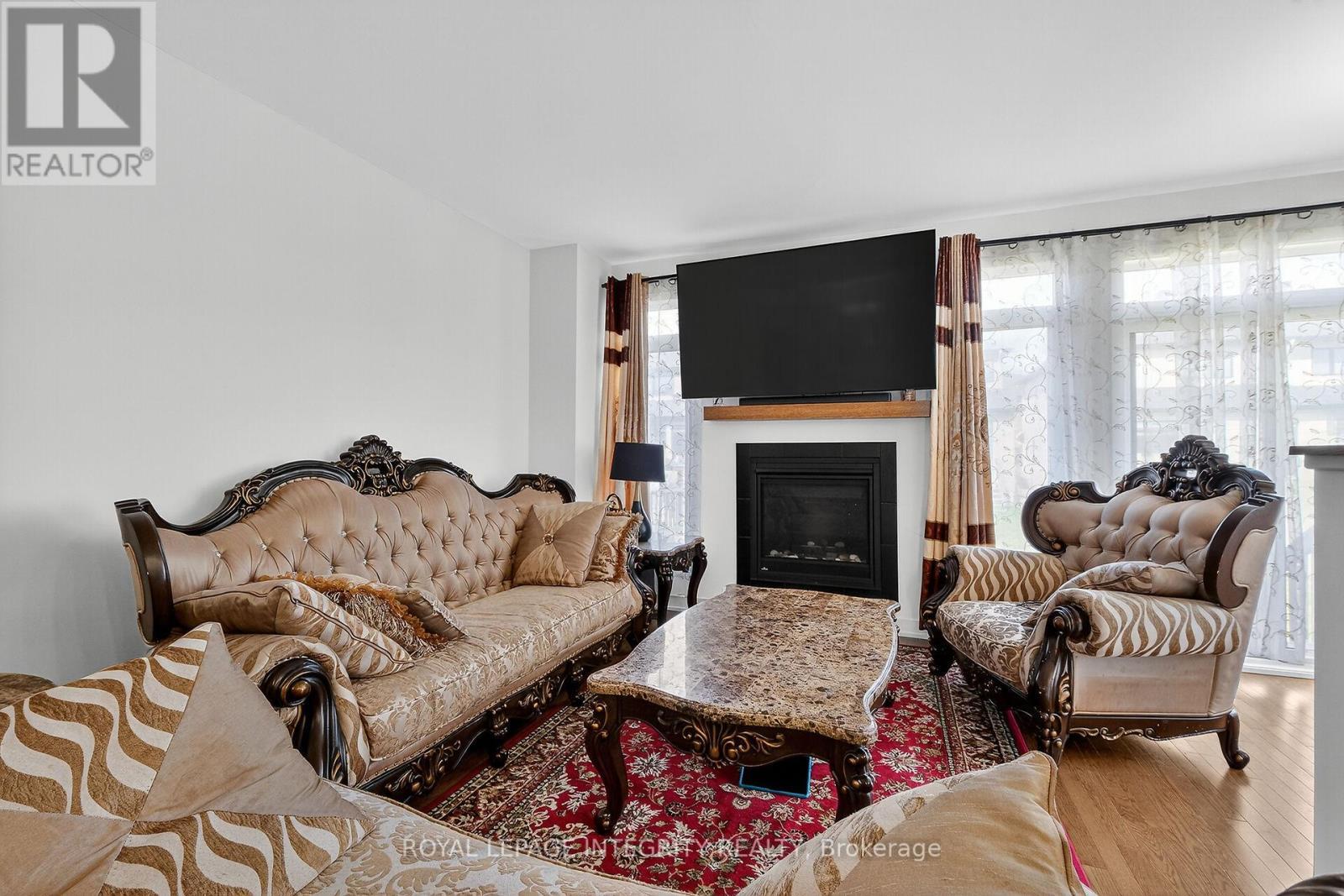 2025 Allegrini Terrace, Ottawa, ON - Indoor Photo Showing Living Room With Fireplace