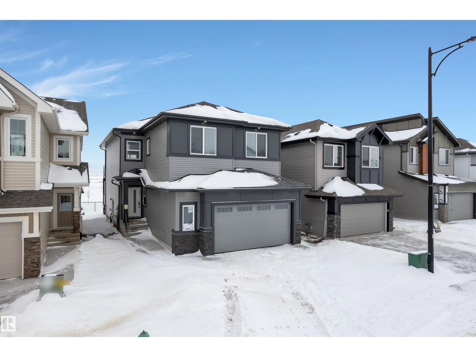 744 Astoria Wy, Devon, AB - Outdoor With Facade