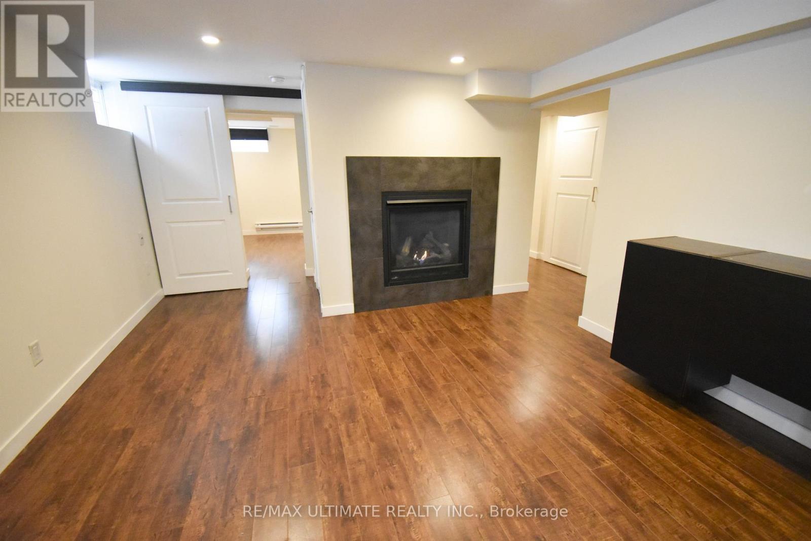 B - 205 Innisfil Street, Barrie, ON - Indoor Photo Showing Living Room With Fireplace