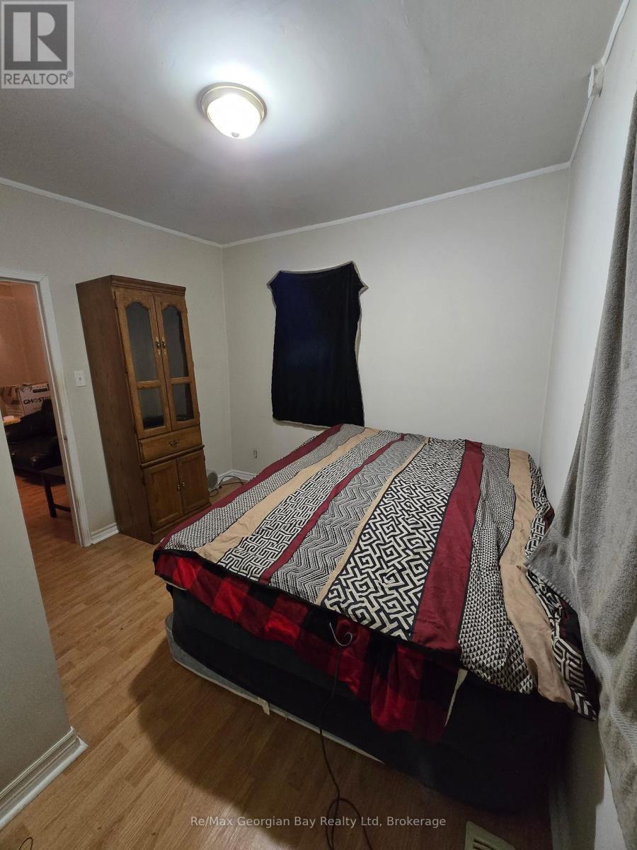 2nd Main Floor Bedroom - 8 Mill Street, Severn (Coldwater), ON - Indoor Photo Showing Bedroom