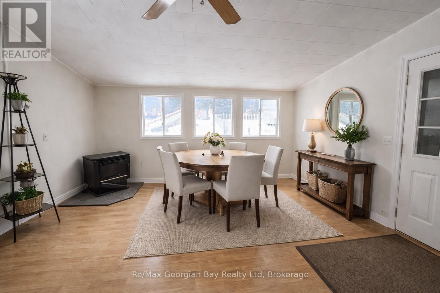 Virtually staged dining/entrance area. - 8 Mill Street, Severn (Coldwater), ON - Indoor Photo Showing Dining Room
