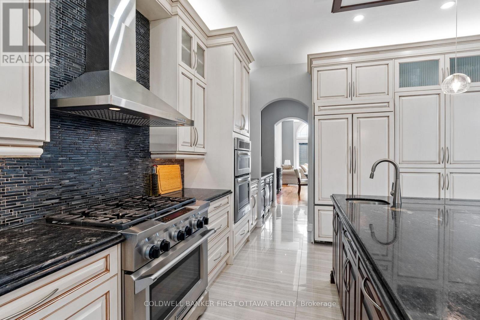 Archway walkthru into the chef inspired kitchen! - 1623 Claymor Avenue, Ottawa, ON - Indoor Photo Showing Kitchen With Stainless Steel Kitchen With Upgraded Kitchen