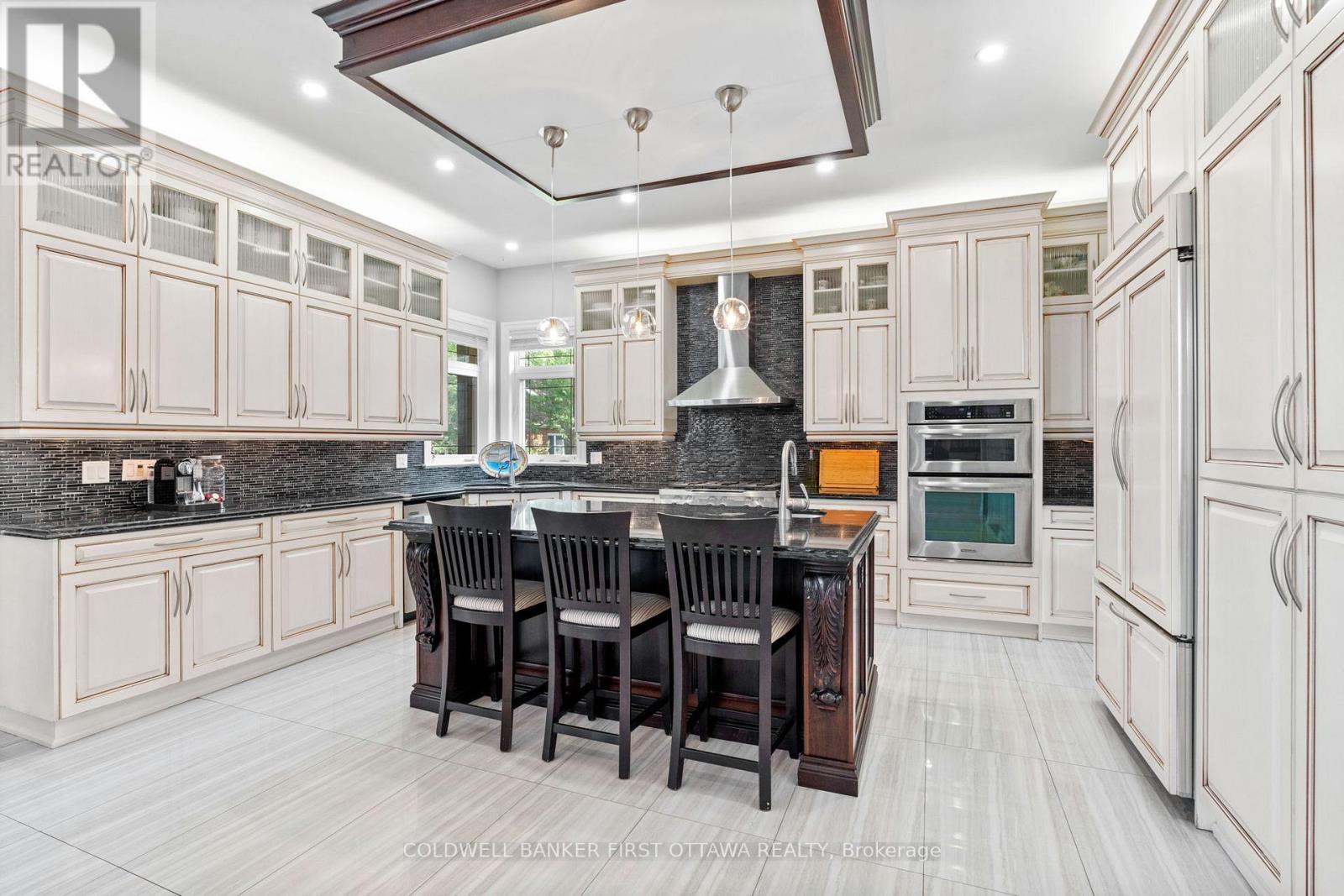 Massive breakfast bar island & custom fixture. - 1623 Claymor Avenue, Ottawa, ON - Indoor Photo Showing Kitchen With Upgraded Kitchen