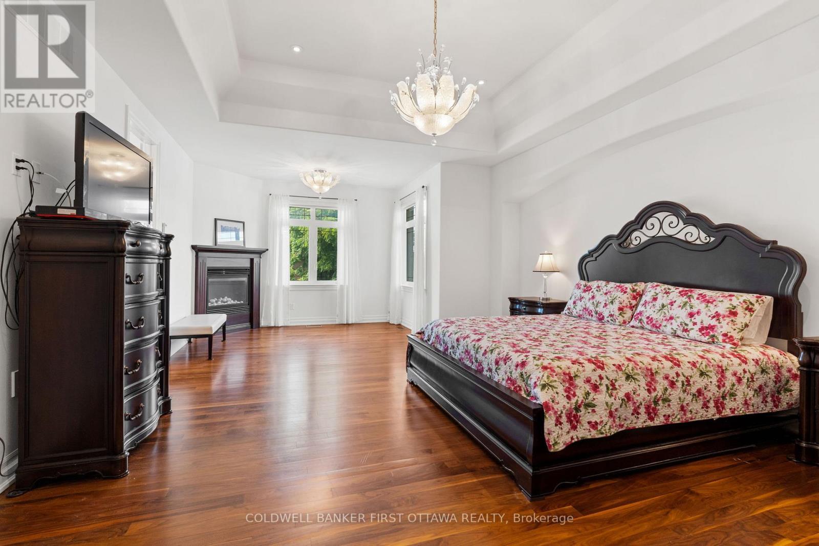 Primary bedroom w gas fireplace & WI Closet. - 1623 Claymor Avenue, Ottawa, ON - Indoor Photo Showing Bedroom