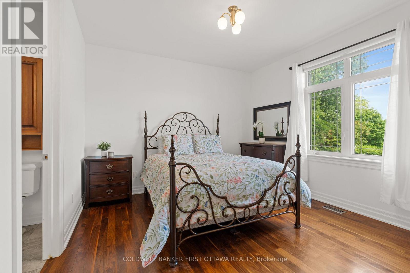 Bedroom w closet & fixture above. - 1623 Claymor Avenue, Ottawa, ON - Indoor Photo Showing Bedroom
