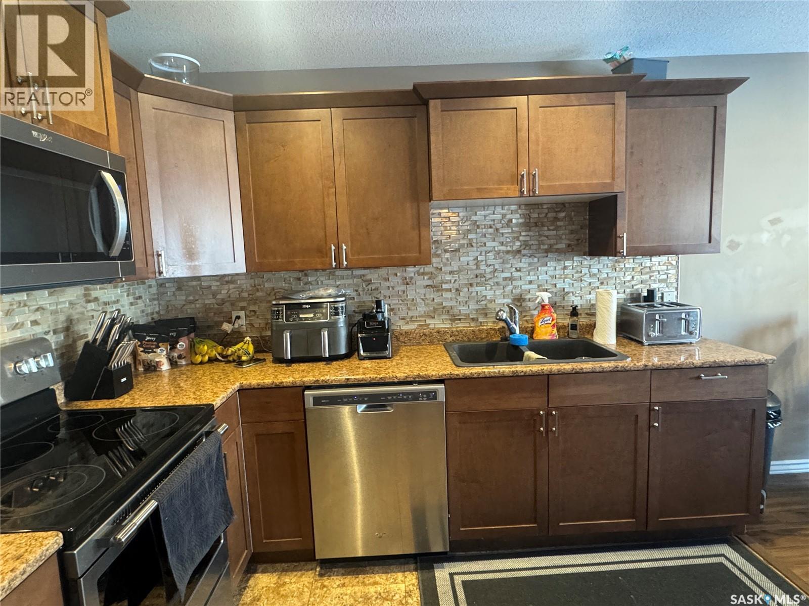 3 1360 Studer Street, La Ronge, SK - Indoor Photo Showing Kitchen With Stainless Steel Kitchen