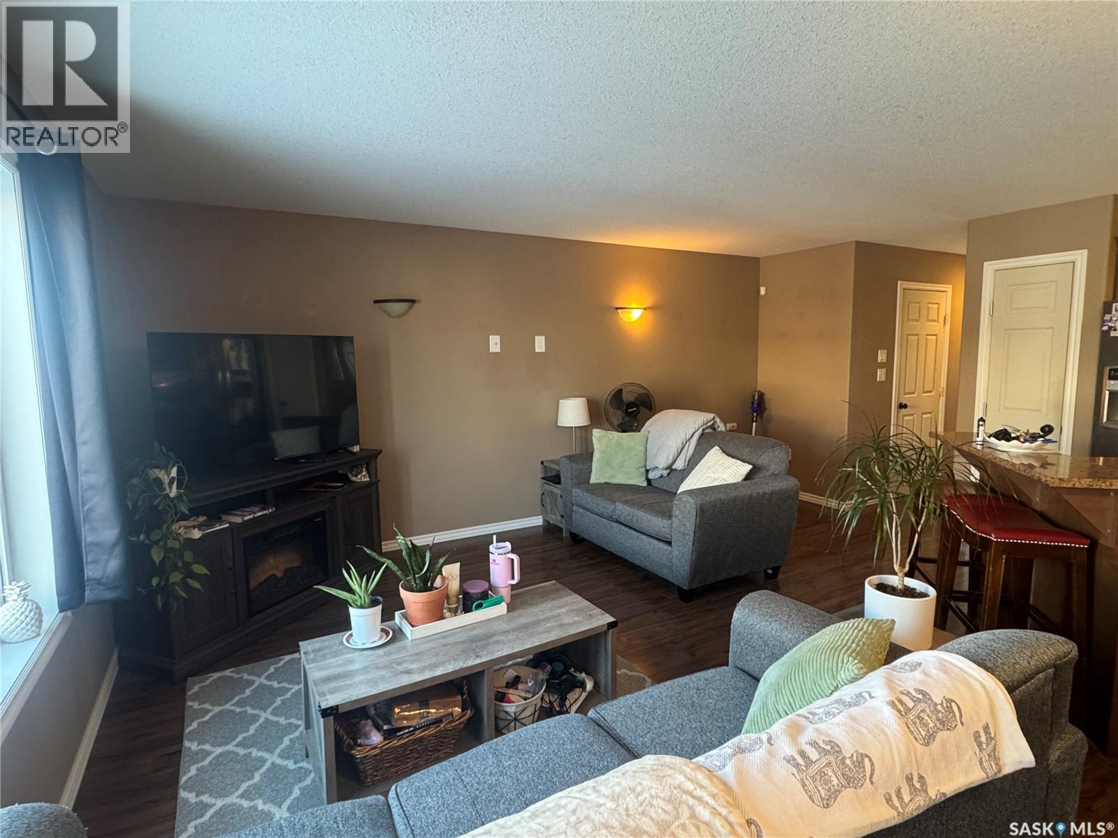 3 1360 Studer Street, La Ronge, SK - Indoor Photo Showing Living Room With Fireplace