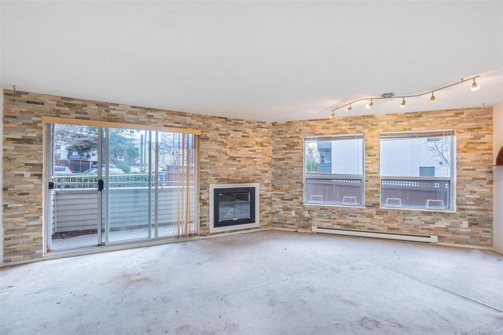 201-1055 Hillside Ave, Victoria, BC - Indoor Photo Showing Other Room With Fireplace
