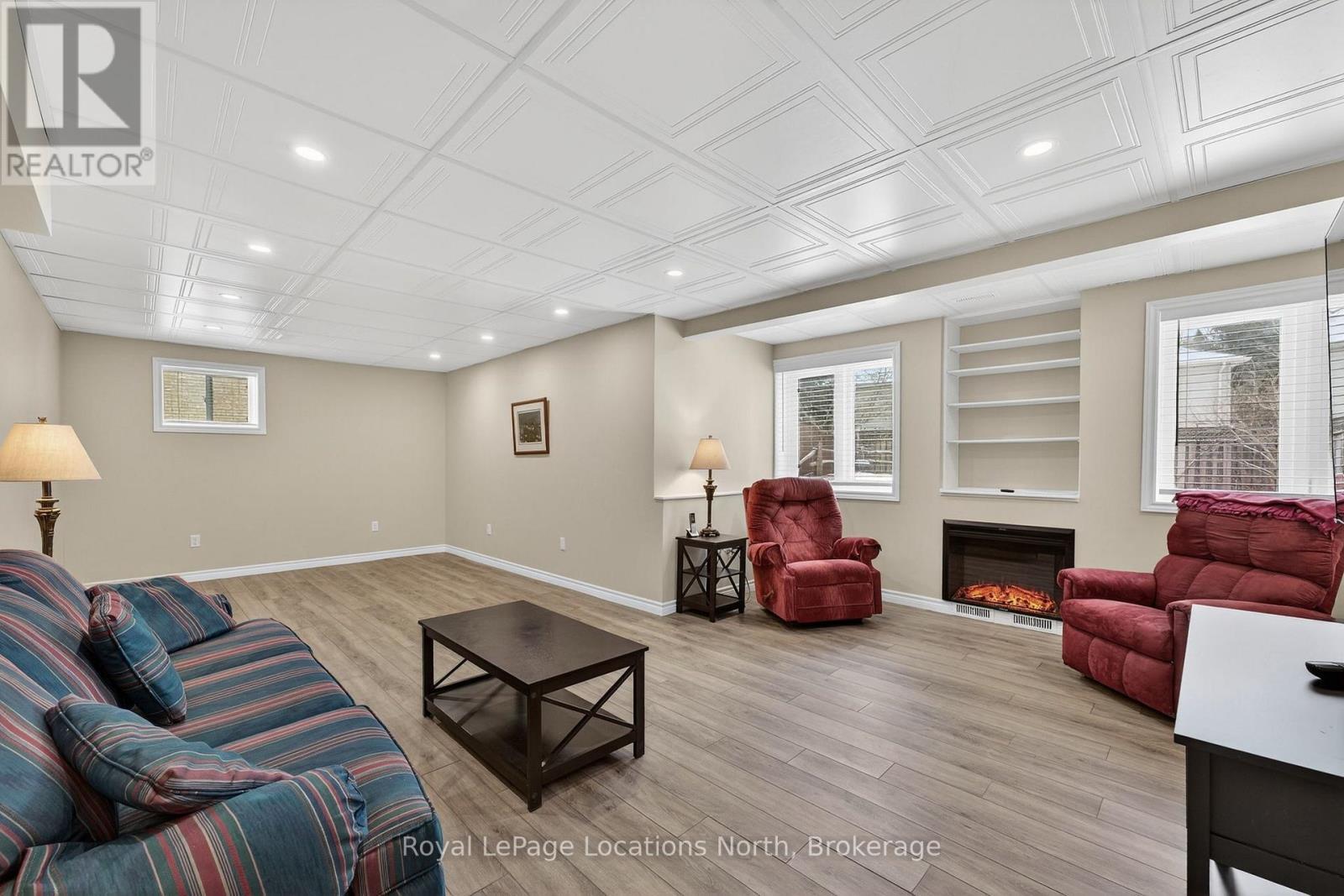 Large family room w/ fireplace - 15 Princess Point Drive, Wasaga Beach, ON - Indoor With Fireplace