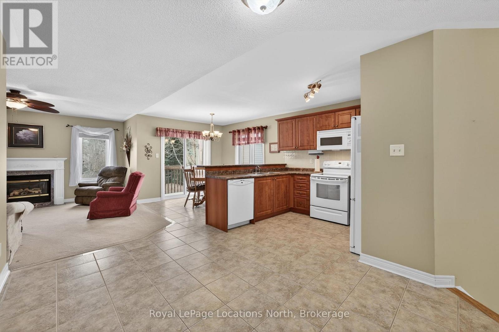 15 Princess Point Drive, Wasaga Beach, ON - Indoor Photo Showing Kitchen With Fireplace