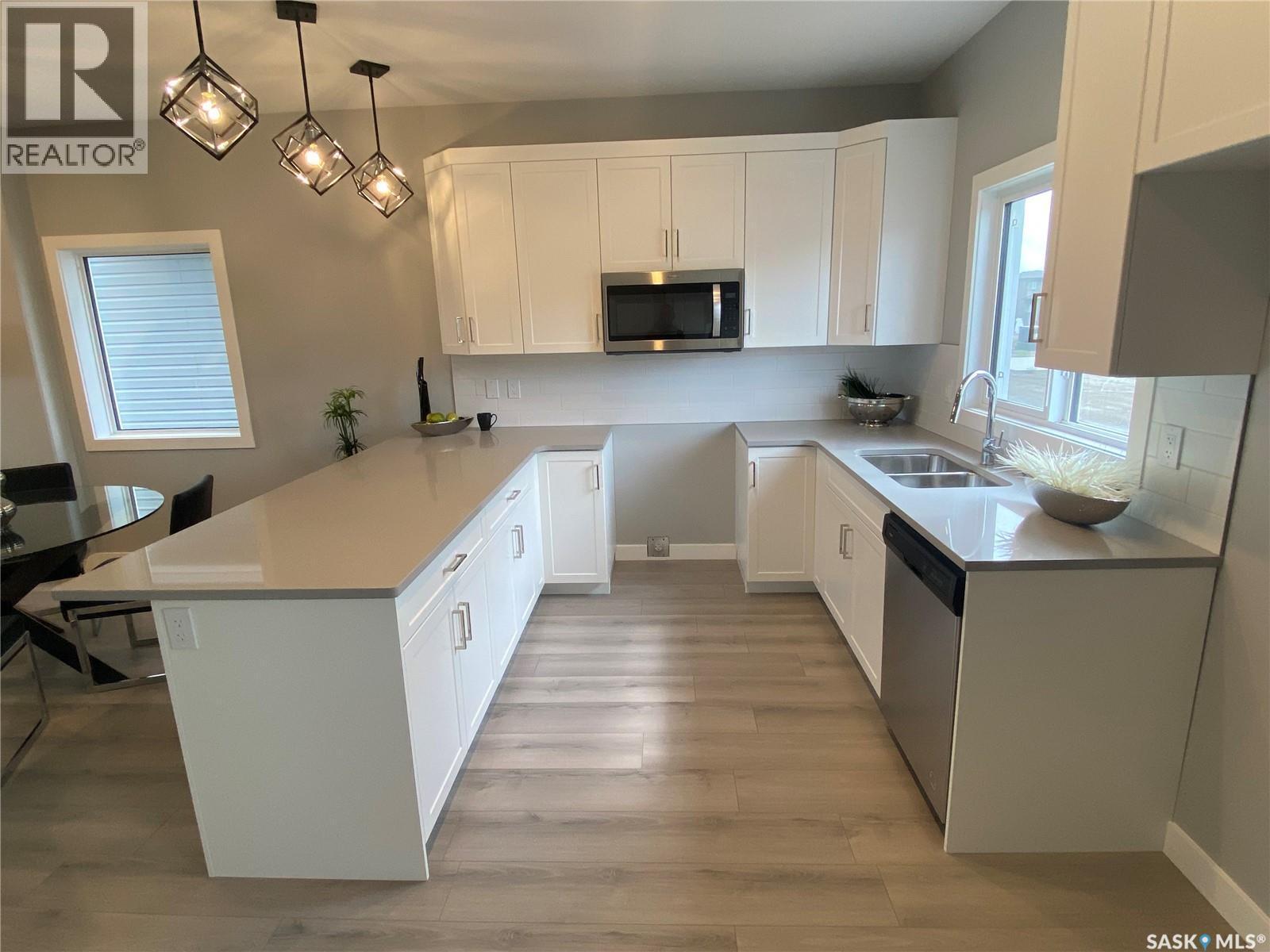 350 Cowessess Road, Saskatoon, SK - Indoor Photo Showing Kitchen With Double Sink