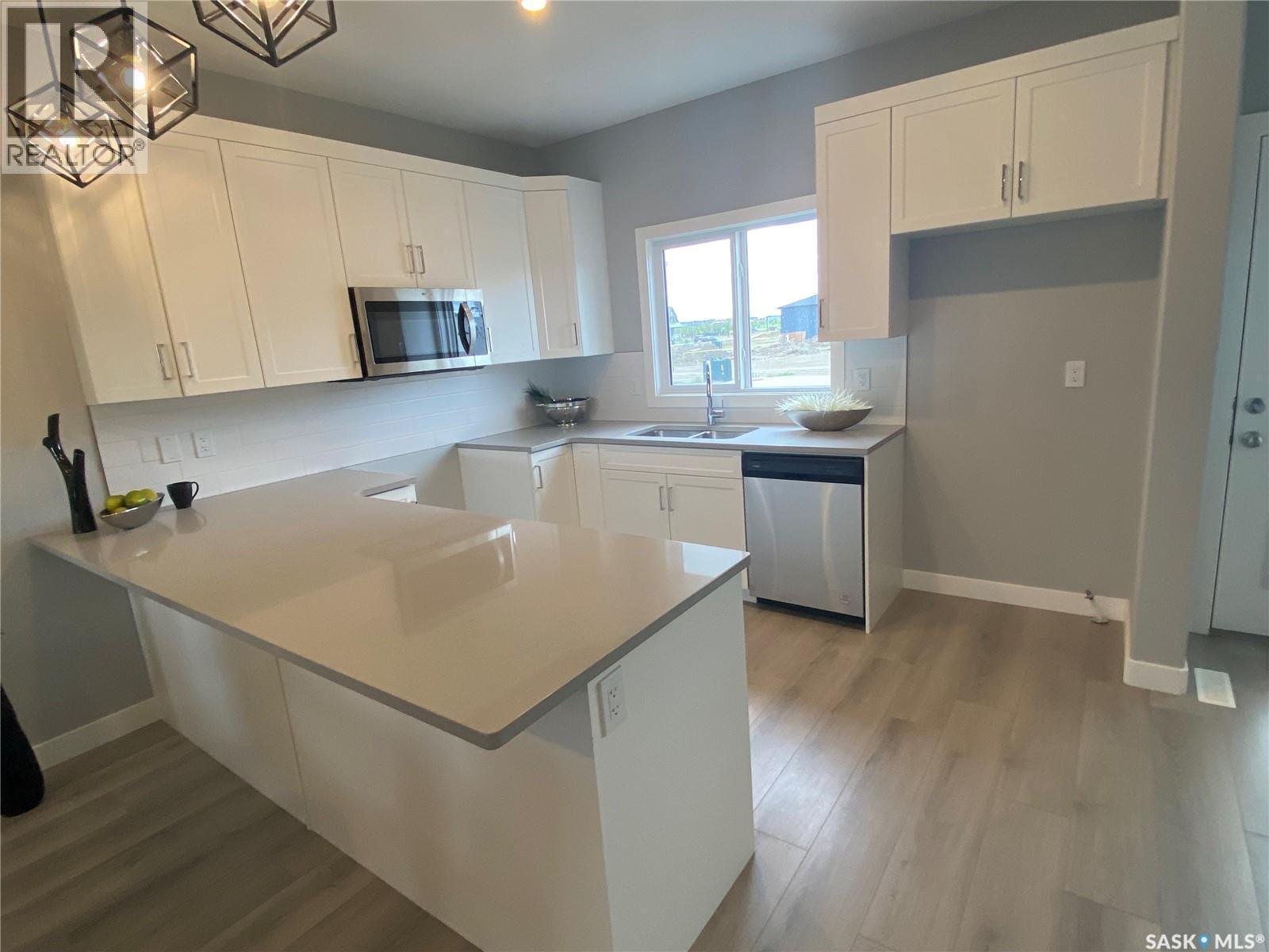 350 Cowessess Road, Saskatoon, SK - Indoor Photo Showing Kitchen With Double Sink