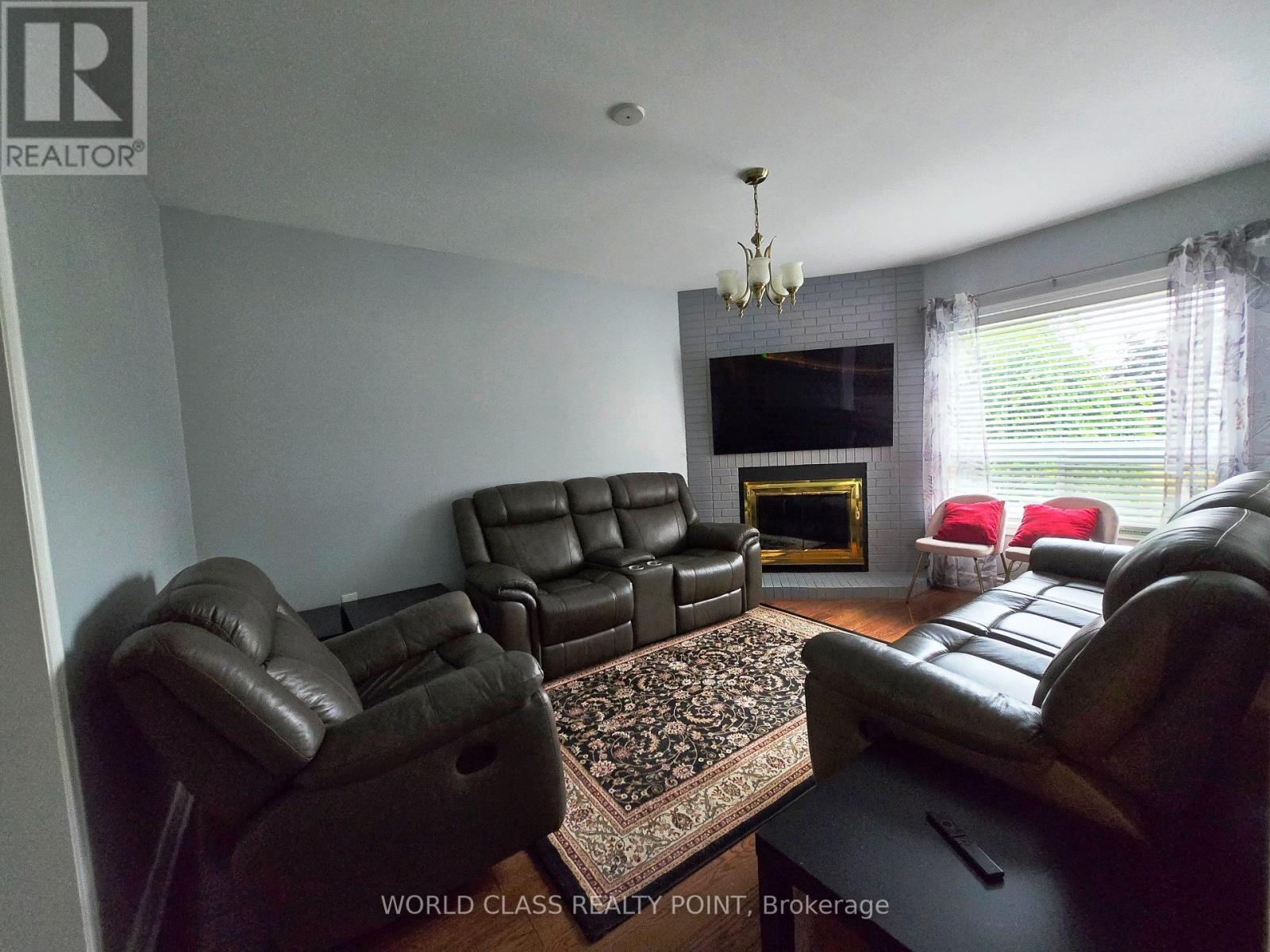 6136 Ford Road, Mississauga, ON - Indoor Photo Showing Living Room With Fireplace