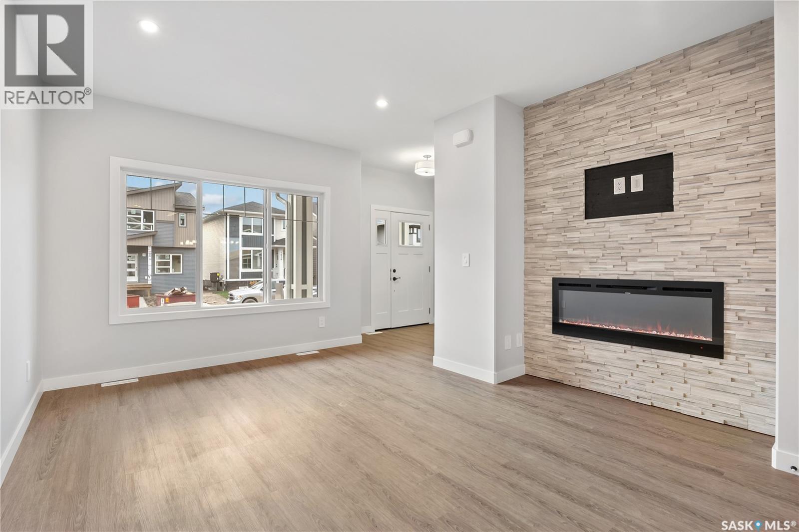 3160 Green Turtle Road, Regina, SK - Indoor Photo Showing Living Room With Fireplace