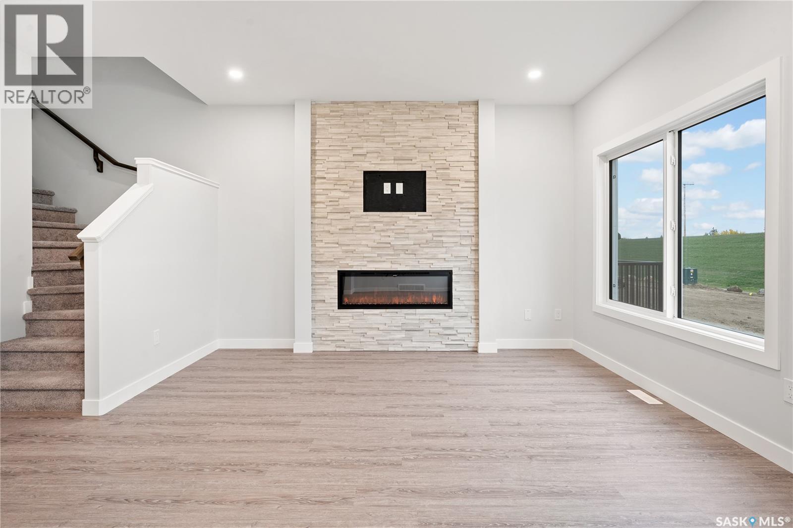 559 Traeger Manor, Saskatoon, SK - Indoor With Fireplace