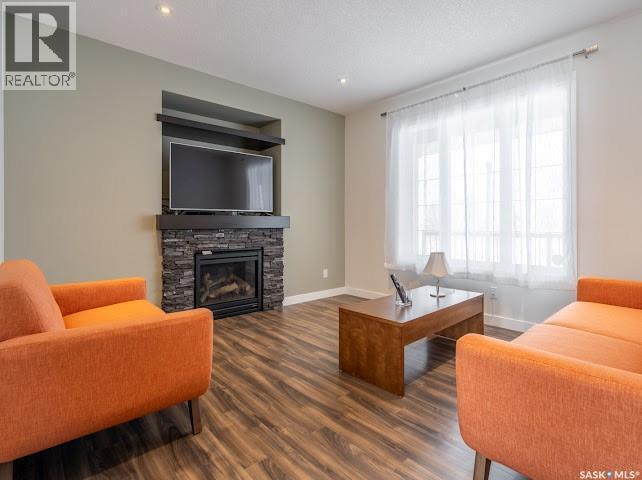 4337 Green Apple Drive E, Regina, SK - Indoor Photo Showing Living Room With Fireplace