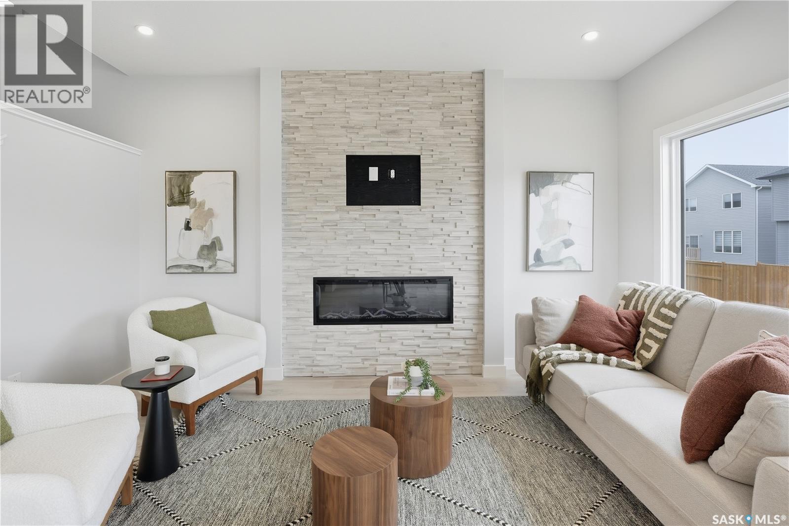 8657 Wheat Crescent, Regina, SK - Indoor Photo Showing Living Room With Fireplace