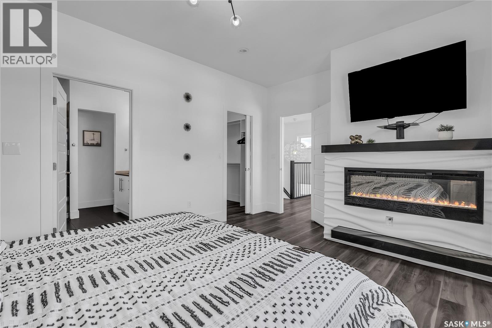 231 Atton Court, Saskatoon, SK - Indoor Photo Showing Bedroom With Fireplace