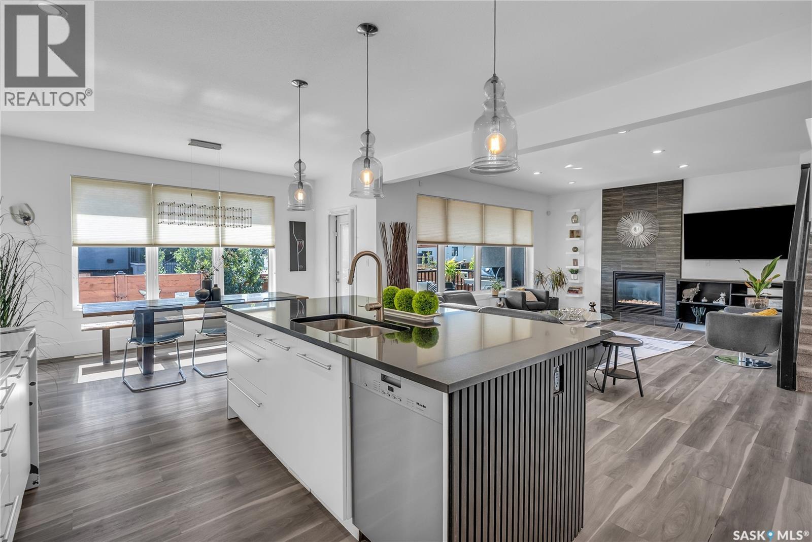 231 Atton Court, Saskatoon, SK - Indoor Photo Showing Kitchen With Fireplace With Double Sink With Upgraded Kitchen